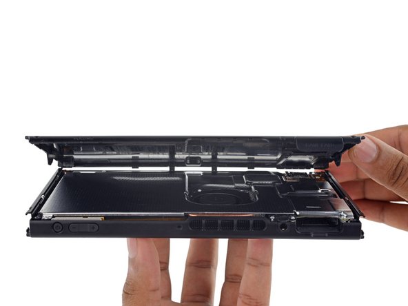 Image 2/3: Our first peek inside reveals—nothing much. Just a metal shield.