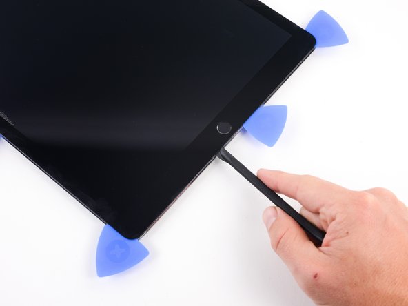 Reinsert the blade of the halberd spudger as deep as it will go.