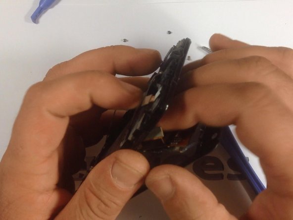 Now, use a suction tool to remove the screen from it's housing. Be careful when doing this, to prevent possible injury.