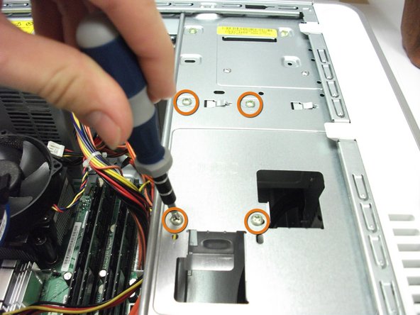 Image 1/1: Locate and remove the four 7.8 mm screws with a Phillips #0 screwdriver.