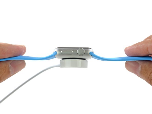 Image 3/3: There's no need for pesky charging cables—the Apple Watch features MagSafe inductive charging technology, which allows it to magnetically attach to the charger. Apple also touts that it is a "...completely sealed system free of exposed contacts."