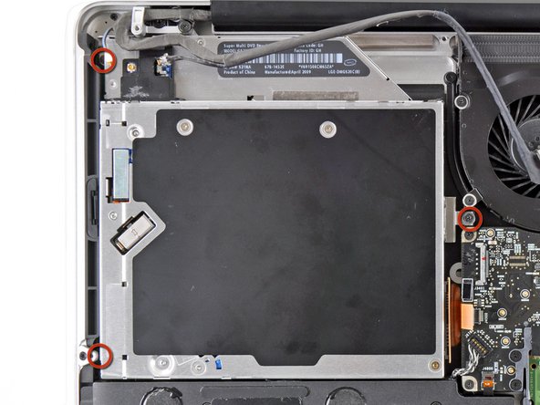 Image 1/1: To remove the screw closest to the battery, it may be helpful to use a T6 Torx screwdriver to first remove the upper case bracket directly above it.