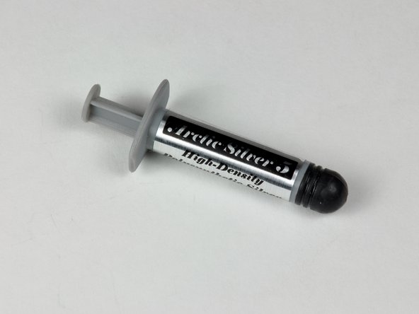 Image 1/1: Use a firm plastic edge to scrape the thermal material off the heat sink.