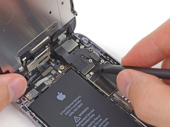 Spudger being used in an iPhone repair