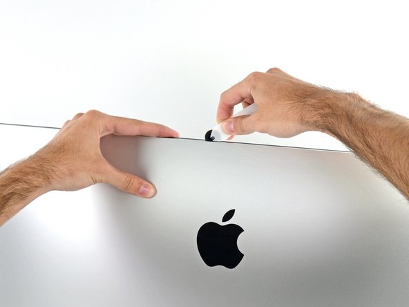 Image 2/2: You may want to run the tool back and forth through what you've already cut a few times, to ensure you get as much of the adhesive separated as possible.