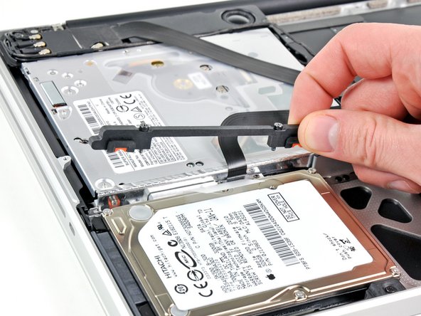 Image 2/2: Remove the hard drive bracket.