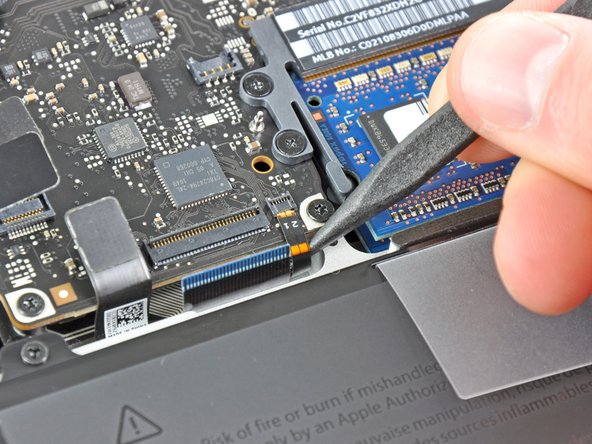 Image 3/3: Pull the keyboard backlight ribbon cable out of its socket.