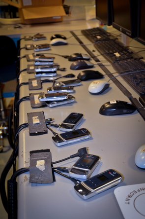 Old cell phones being refurbished at the Recellular warehouse