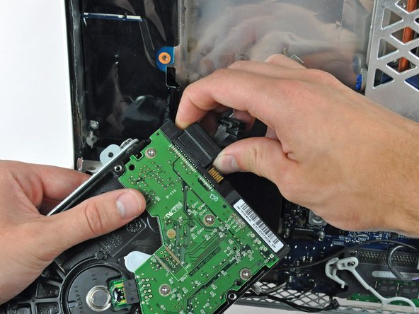Image 1/1: Remove the hard drive from the iMac.