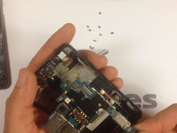 Careful release the motherboard from it's housing.