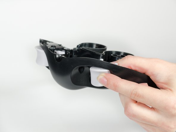 To remove the trigger assembly, depress the trigger with your index finger as if you are using the controller normally.