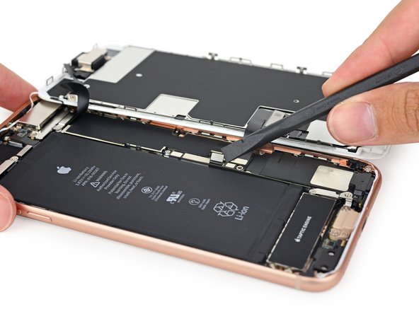 The battery connector is no match against our trusty spudger. Just like we saw  in the iPhone 8,  Apple ditched the tricky tri-points we're accustomed to seeing on this bracket and replaced them with Phillips #000 screws.