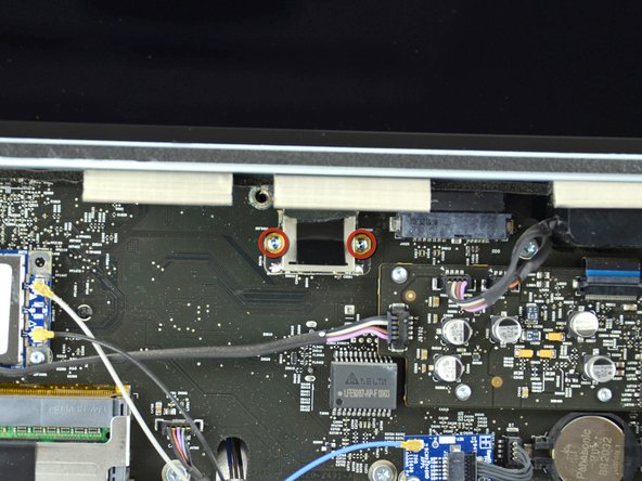 Remove the two 5.3 mm T6 torx screws from the LCD connector.