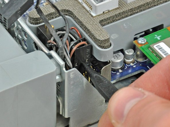 Image 2/2: The speaker cable connector attaches to the pins closest to the power supply. It is the only connector with four wires. The microphone cable attaches to the pins furthest away from the power supply and is the only connector with a dark orange wire.