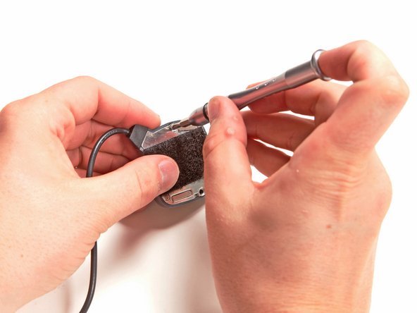 Image 1/3: Removing a few Phillips screws allows us to access the innards of the GPS antenna.