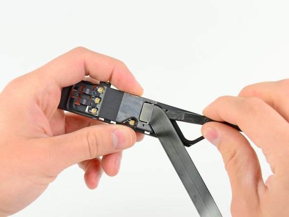 Image 1/2: Remove the AirPort/Bluetooth cable from the AirPort/Bluetooth assembly.