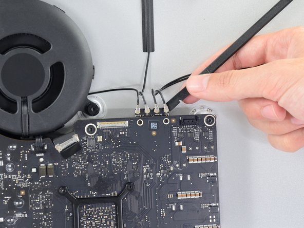 Image 1/2: Note the original positions for each connector when reconnecting the cables—from left to right on the card, the antennas are connected in the following order: