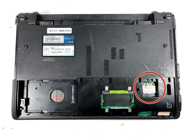 Disconnect both the black and white coaxial connectors from the WiFi card by pulling up on the gold colored piece.