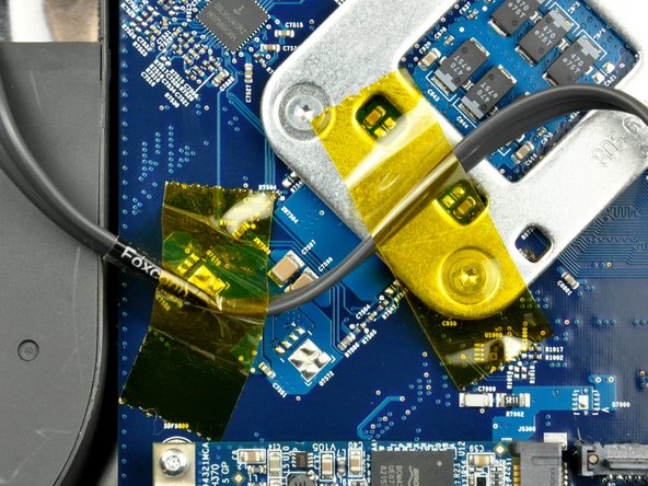 Image 1/1: Move the SATA data cable away from the face of the logic board.