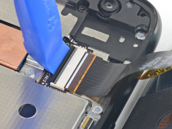 Use an opening tool to flip up the wide lock bar on the display cable's ZIF socket, near the top right of the phone.