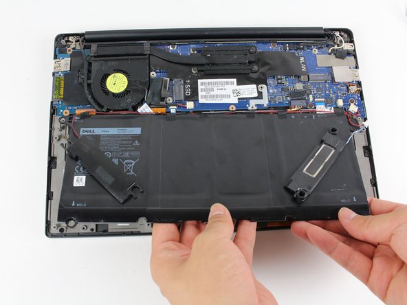 Use your hands to gently lift up the battery.