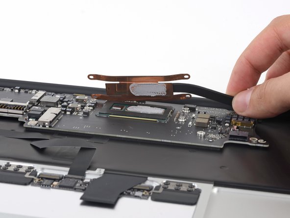 Image 2/3: These components are mere collateral damage to get to the logic board.