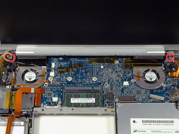 Image 1/1: Two 9.5 mm silver T6 Torx screws with threads on only part of the shaft on the inside of the display hinges.