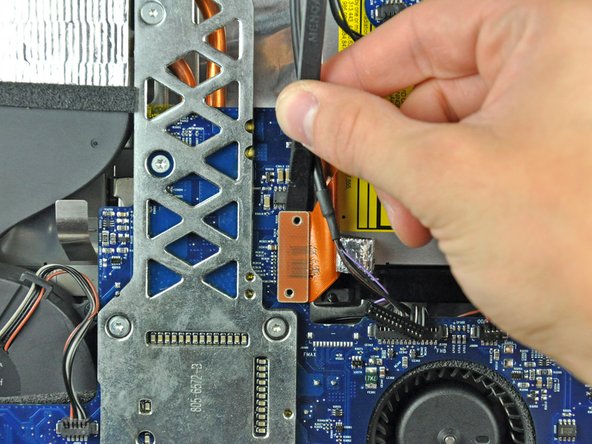 Image 1/1: It is helpful to insert the spudger under the top or bottom edge of the connector and twist to separate the connector from the logic board.