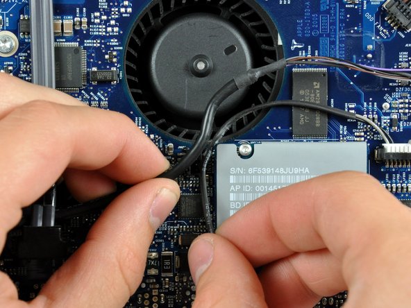 Image 1/2: Pull the speaker connector toward the top edge of your iMac to disconnect it from the logic board.