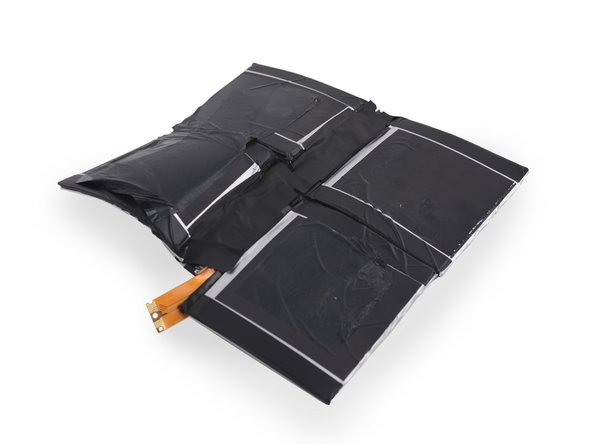 Image 2/3: The battery is out, but it looks like it passed through a [http://www.nofrackingway.us/wp-content/uploads/2013/04/funhouse-mirror.jpg|fun house mirror|new_window=true] to get free. We're not so fond of clowns who believe in glued-in batteries.