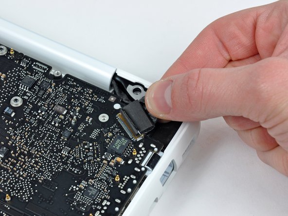 Image 1/2: Pull the socket parallel to the face of the logic board.