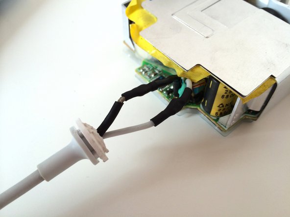 Image 3/3: Make sure to do this step really quickly, as the heat-shrink tube will contract from the heat of the soldering.