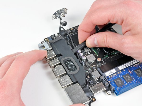 Image 1/1: Remove the left speaker.