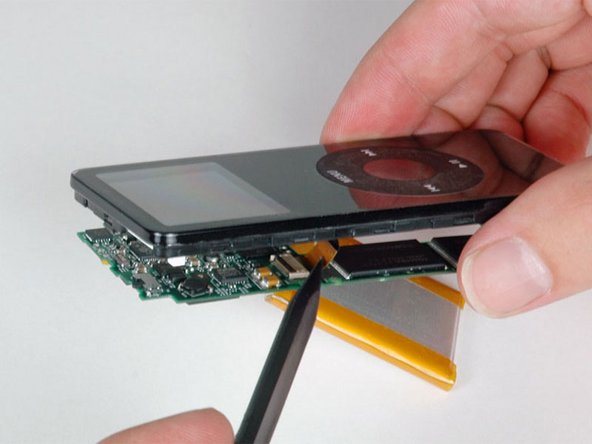Use a spudger to slide the display ribbon out of its connector.
