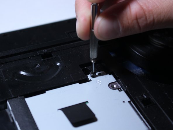 Remove all 4 screws holding the hard drive in with the screwdriver.