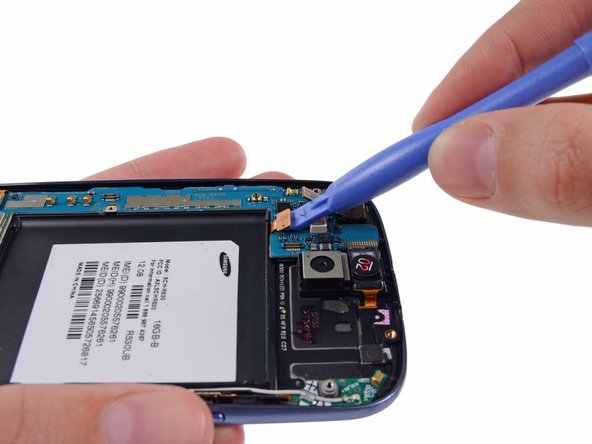 Image 2/2: Disconnect the digitizer cable by gently prying its connector up from its socket on the motherboard.