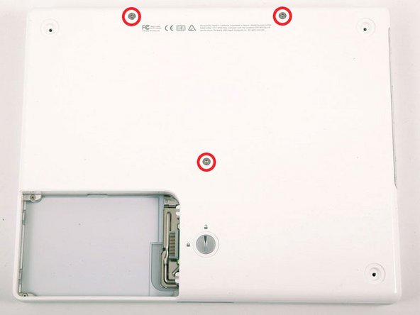 Image 1/1: The shorter screw is in the center of the computer.