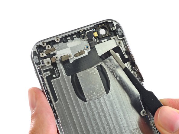 Image 1/2: Just like that, the button assemblies are out of their iPhone shell.