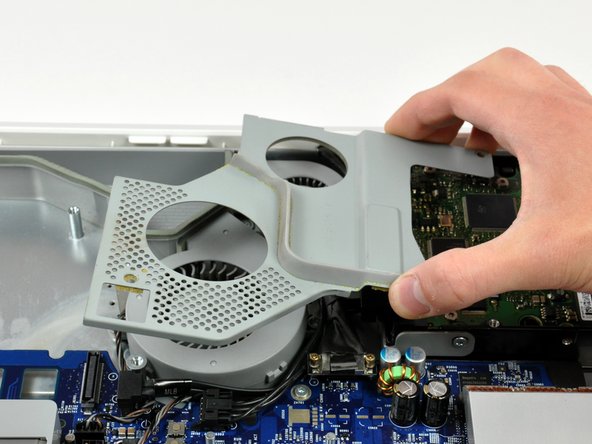 Image 2/2: Lift the fan cover out of the midplane.