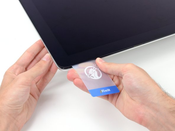 Image 2/2: Move slowly and be careful not to stress the display glass too much—you only need to make a gap of about 1/4".