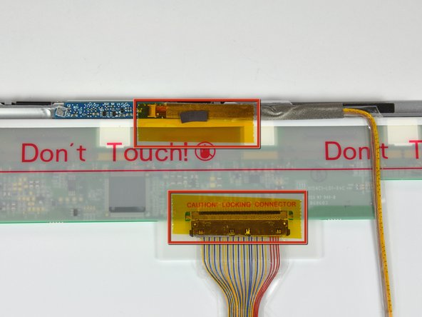 Image 1/2: Carefully peel the camera cable off the foam tape along the top edge of the LCD.