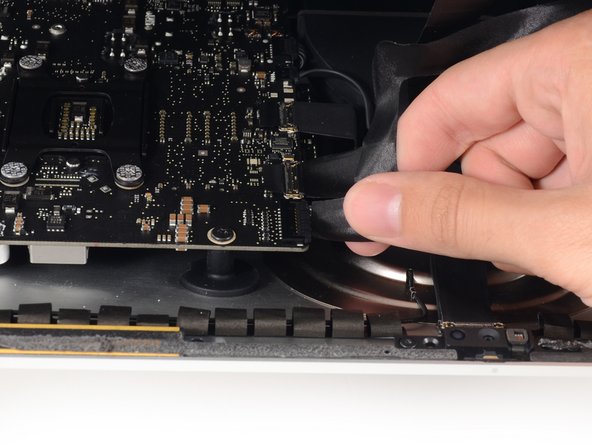 Image 1/2: Lift the display up enough to have easy access to the connector, but not so much that you stretch the cables and stress their connections (about 8").