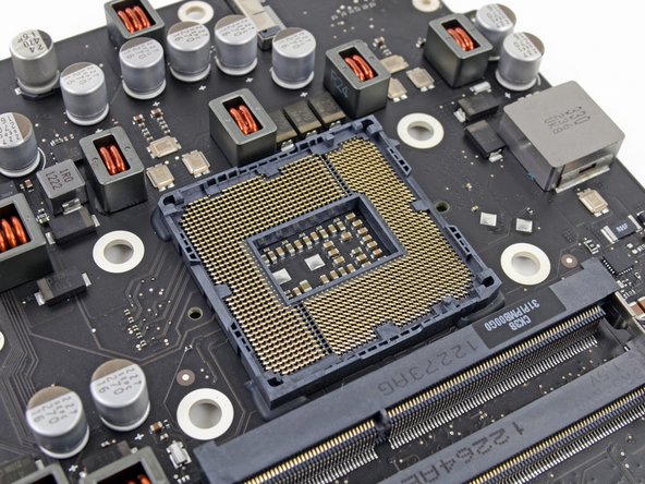 Image 3/3: The new iMac uses a spring-loaded, [http://en.wikipedia.org/wiki/LGA_1155|FCLGA1155] socket to make all those little electrical signals go into, and out of, the CPU.