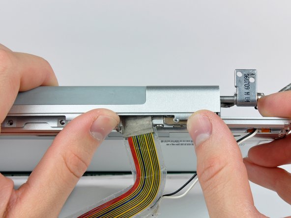 Image 2/2: Remove the clutch assembly from the front display bezel.