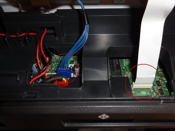 Remove the blue connector and the ribbon cable gently