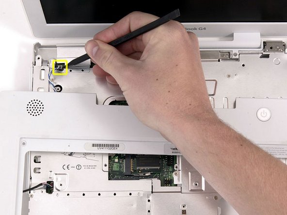Image 1/1: Lift the upper case enough to disconnect the blue and white power cable from the logic board. Using your fingernails or a dental pick, carefully pry the connector from its socket. Make sure you're pulling only on the connector and not on the socket.