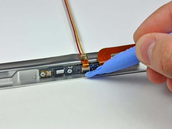 Image 1/3: Pull the camera cable out of its socket.