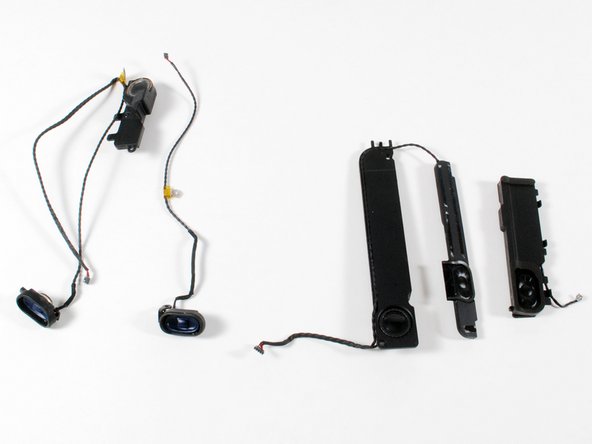 Image 2/2: The new MacBook received a welcome speaker upgrade. In the second image, the old plastic MacBook's speakers are on the left, and the new MacBook's speakers are on the right.