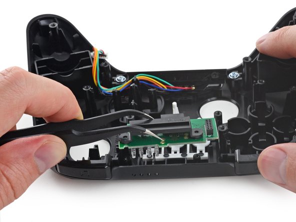 Image 2/2: The insides of this controller look pretty standard, calling into question whether Amazon is [http://www.forbes.com/sites/insertcoin/2014/04/03/ouya-responds-to-amazon-borrowing-their-model-with-firetv/|trying to storm the gaming] world, or merely adding features to [http://www.newyorker.com/online/blogs/currency/2014/04/fire-tv-and-amazon-commitment-to-consumption.html|boost content downloads]—or perhaps both.