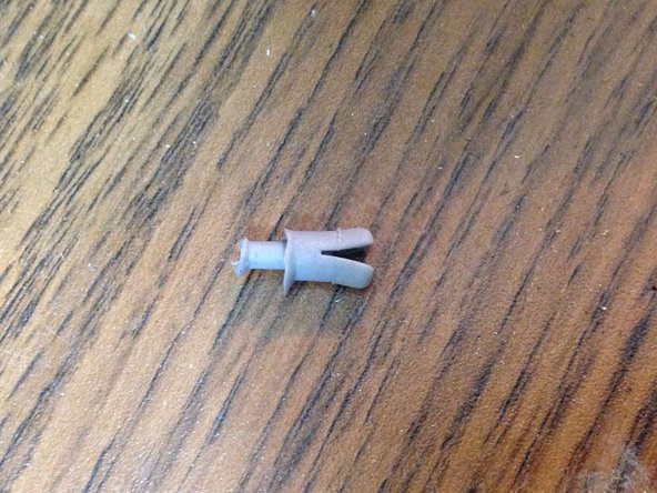 Image 2/2: Pull the metal plate to the left and outward to remove the plate from the processing/cooling unit.